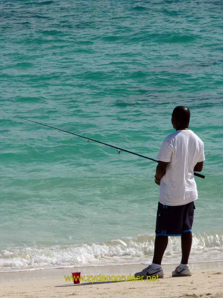 315: Carnival Sensation, Freeport, Bahamas - Man fishing near Billy Joe's Restaurant